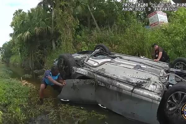 Amazon driver helps deputies rescue three people from car flipped in canal