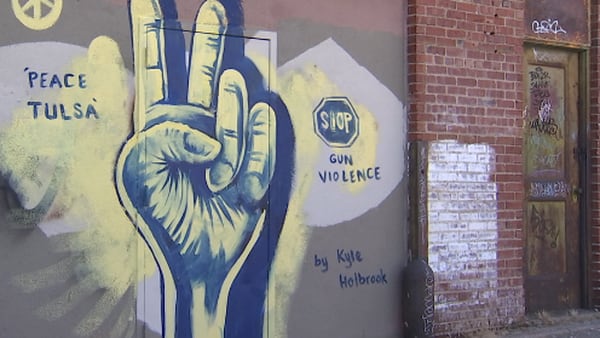 Artist paints mural in downtown Tulsa, hopes to raise awareness about gun violence