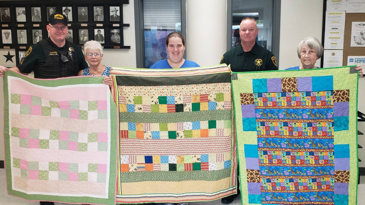 Pryor organization gives deputies handmade quilts to place in cruisers