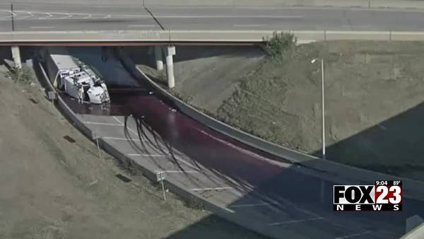 Video: Overturned semi spills liquid cranberries on highway