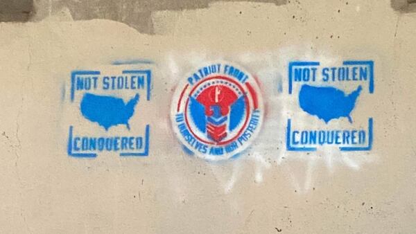 White supremacist group images spray painted under a south Tulsa bridge
