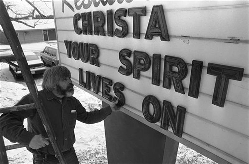 Richard Greene adjusts a letter as he sets up a billboard outside a Concord, New Hampshire motel on Thursday, Jan. 30, 1986. Teacher Christa McAuliffe, who taught at Concord High School, was a crewmember aboard the ill-fated Space Shuttle Challenger. (AP Photo/Peter Southwick)