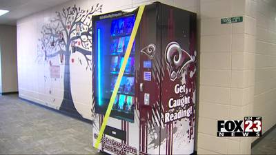 Owasso 6th Grade Media Center unveils book vending machine to encourage reading, good deeds