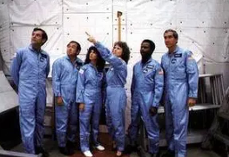 Right: Francis R. “Dick” Scobee, Ellison S. Onizuka, Judith A. Resnik, McAuliffe, Ronald E. McNair, and Michael J. Smith in the payload bay of the full
fuselage space shuttle trainer at JSC.